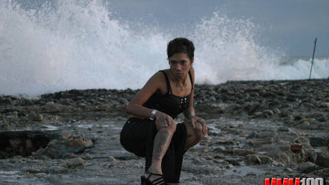 Hot brunette Canele stripping on the beach 