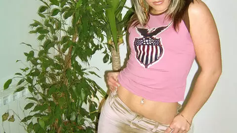 Teen blonde stripping naked on a sofa