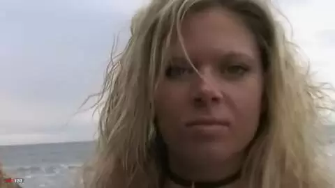 Pretty blonde with big boobs Electra doing a strip on the beach 