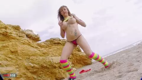 Pornstar blonde with big boobs Eva Lange stripping on the beach 