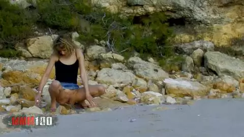 Evy Sky peeing on a public beach