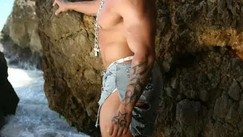 Horny Rob Diesel removing clothes on the beach 